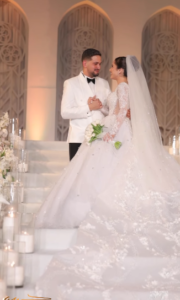 314032-رنا-رئيس-وعريسها-180x300 رومانسية رنا رئيس وزوجها فى أحدث صور من حفل زفافها